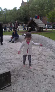 Liesl Playing in Sandbox in Antwerp
