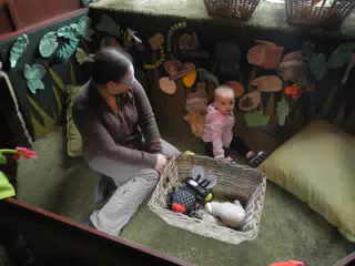 Dominica with Luciana in the Baby Play Area