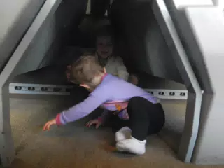 Liesl and Luciana Playing Under the Seats on the Eurostar