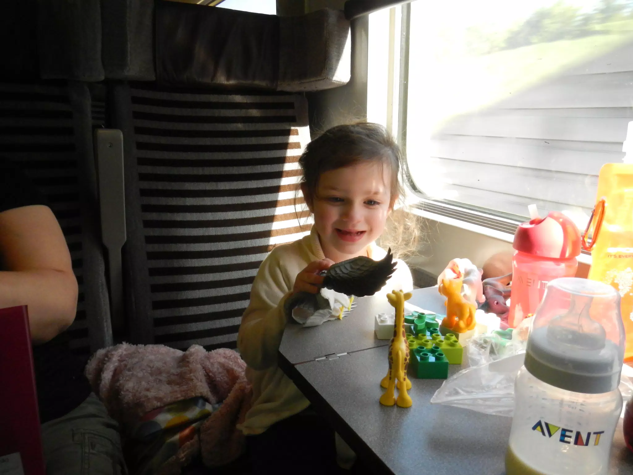 Liesl Playing with Toys on the Eurostar