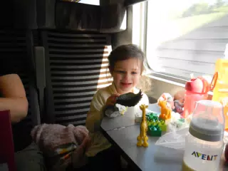 Liesl Playing with Toys on the Eurostar
