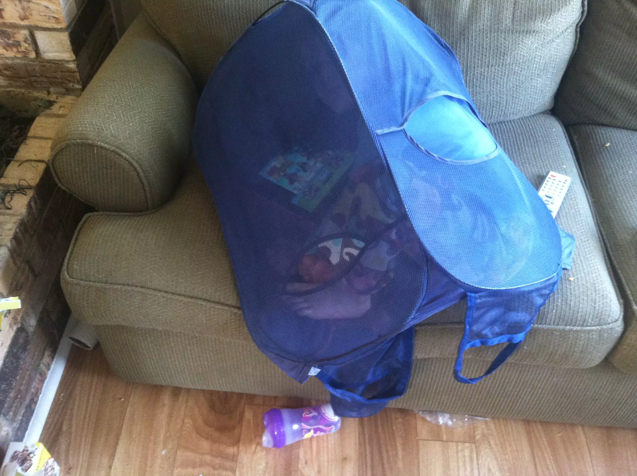 Liesl inside a hamper using the iPad