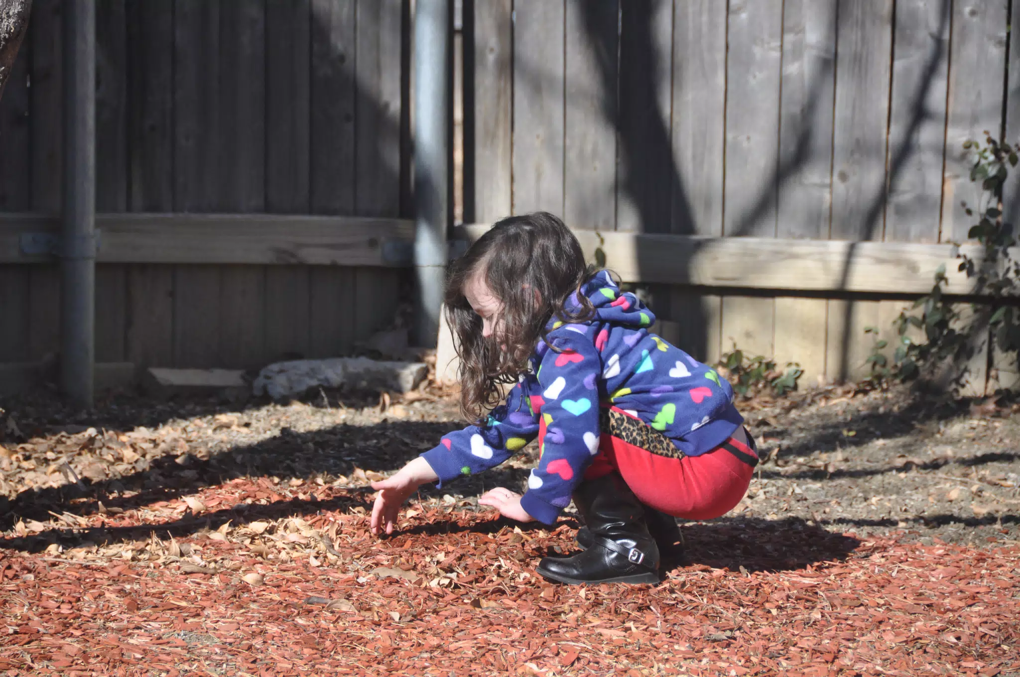 Liesl Playing in the Mulch